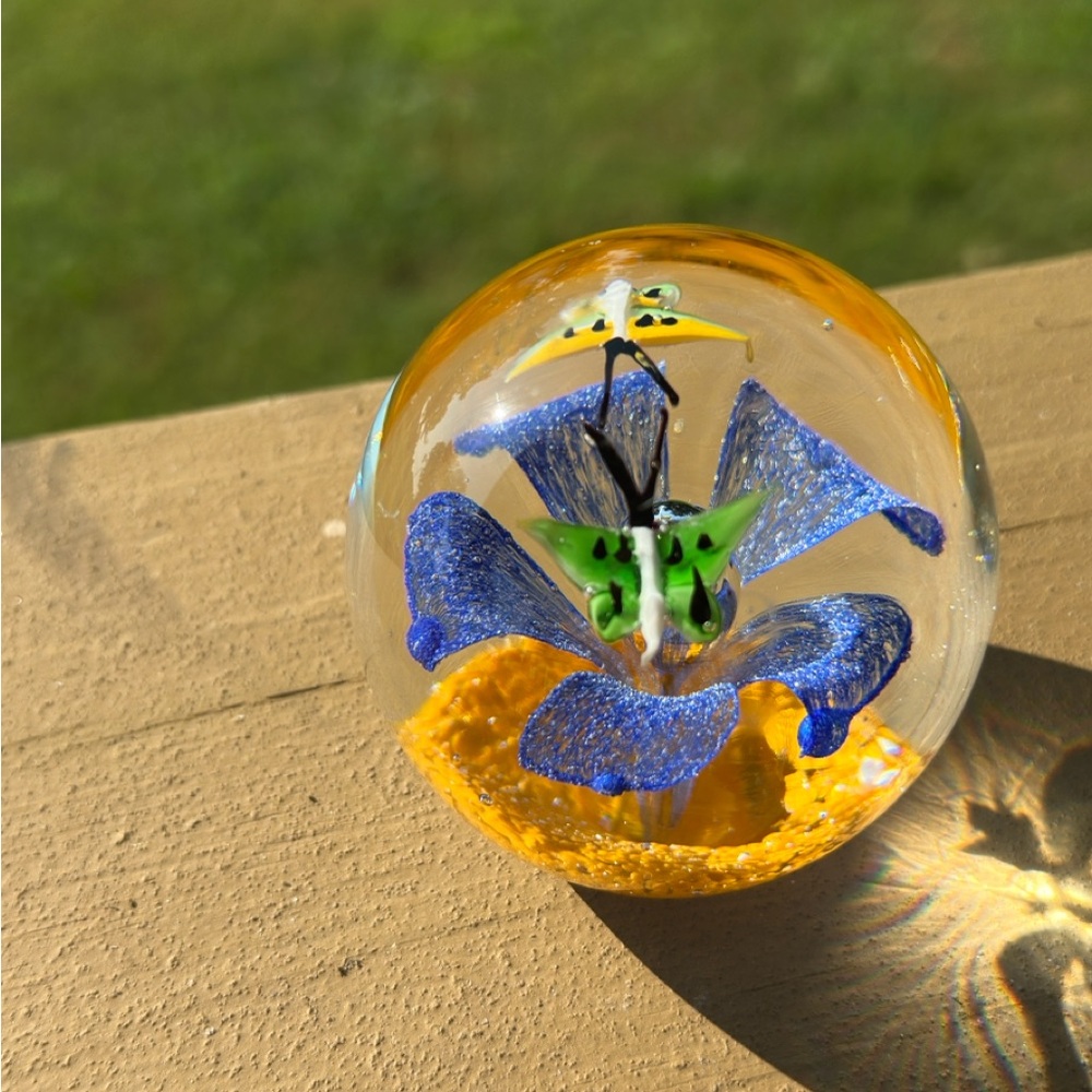 Vintage 2 1/2” round glass blue and orange flower with 2 butterflies